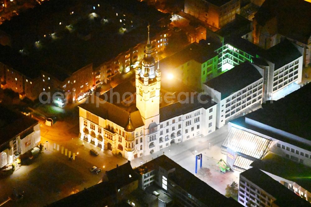 Aerial image at night Dessau - Night lighting town Hall building of the City Council at the market downtown in Dessau in the state Saxony-Anhalt, Germany