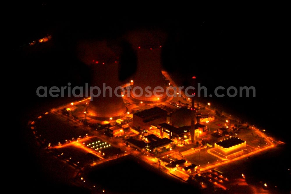 Aerial photograph at night Grafenrheinfeld - Night lighting Building remains of the reactor units and facilities of the NPP nuclear power plant in Grafenrheinfeld in the state Bavaria