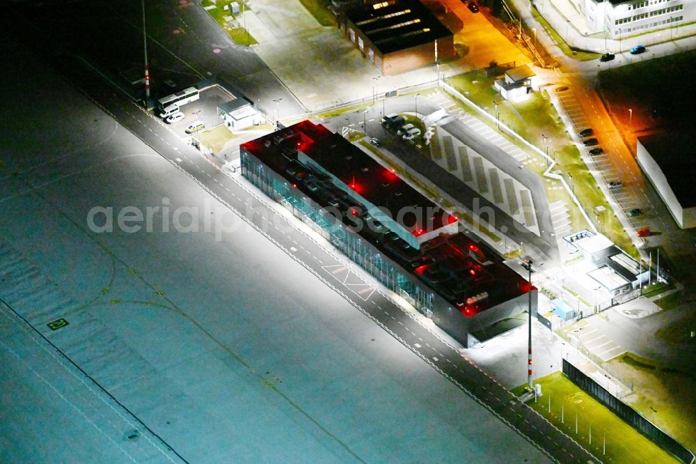 Schönefeld at night from above - Night lighting grounds of the airport Government airport - reception building in the protocol area at BER airport in Schoenefeld in the state Brandenburg, Germany