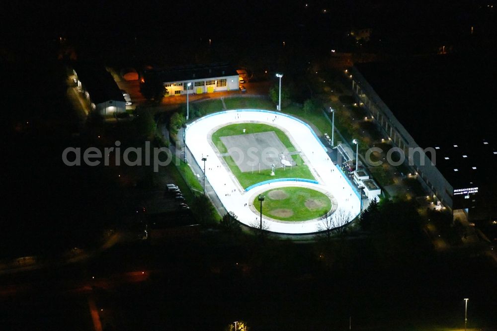 Dresden at night from the bird perspective: Night lighting racetrack racecourse of Dresdner Eislauf-Club e.V. on Pieschener Allee in the district Friedrichstadt in Dresden in the state Saxony, Germany
