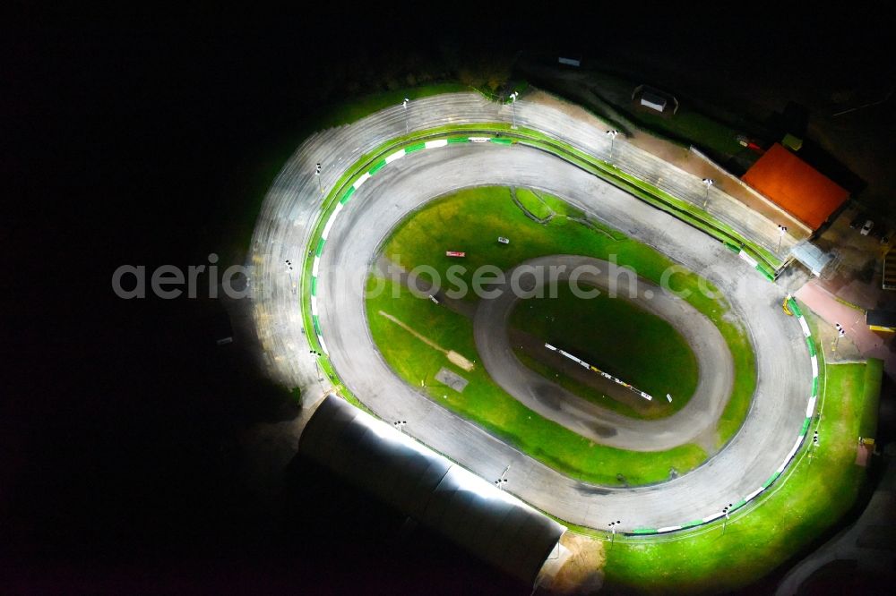 Aerial image at night Güstrow - Night lighting Racetrack racecourse of MC Guestrow on Plauer Chaussee in the district Gleviner Burg in Guestrow in the state Mecklenburg - Western Pomerania, Germany