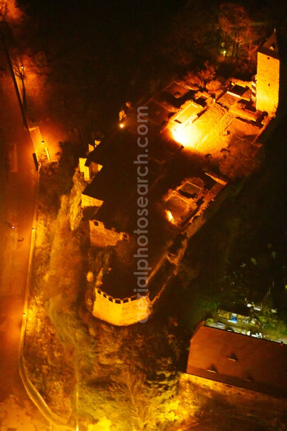 Aerial photograph at night Halle (Saale) - Night lighting Ruins and vestiges of the former castle and fortress Burg Giebichenstein on Seebener Strasse in Halle (Saale) in the state Saxony-Anhalt