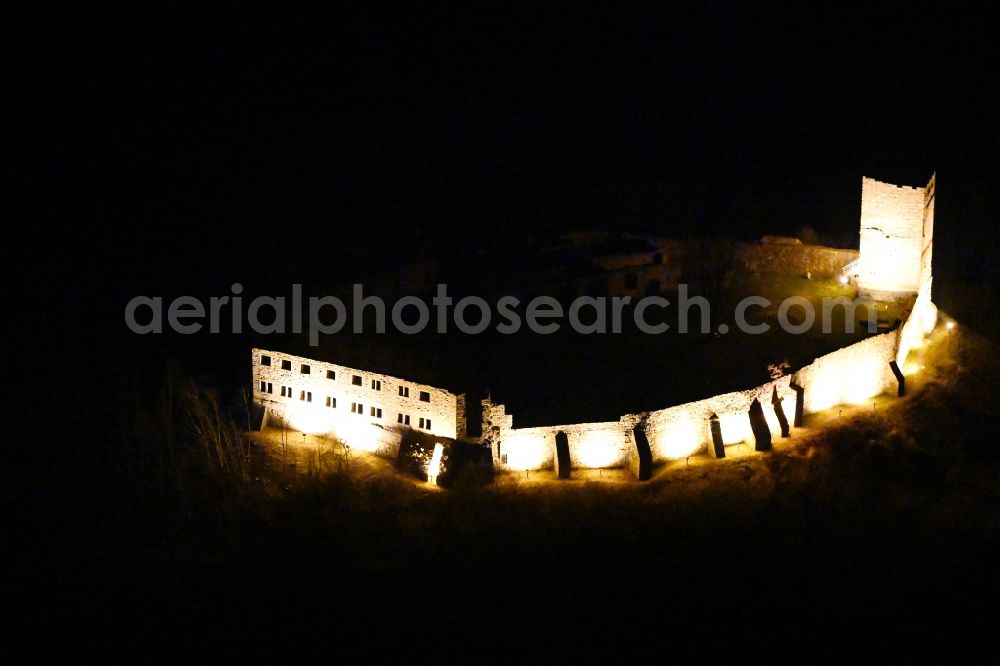 Aerial image at night Drei Gleichen - Night lighting ruins and vestiges of the former castle and fortress Burg Gleichen on Thomas-Muentzer-Strasse in the district Wandersleben in Drei Gleichen in the state Thuringia, Germany