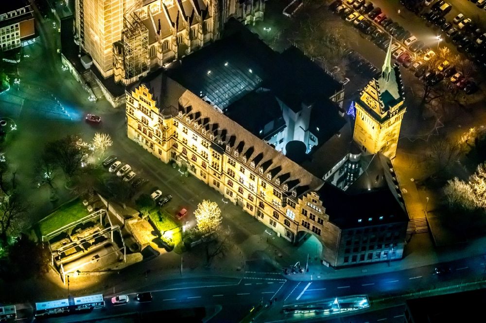 Aerial image at night Duisburg - Night lighting town Salvator church and Hall building of the city administration in Duisburg in the state North Rhine-Westphalia, Germany