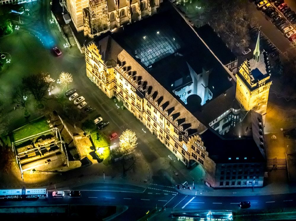 Aerial image at night Duisburg - Night lighting town Salvator church and Hall building of the city administration in Duisburg in the state North Rhine-Westphalia, Germany