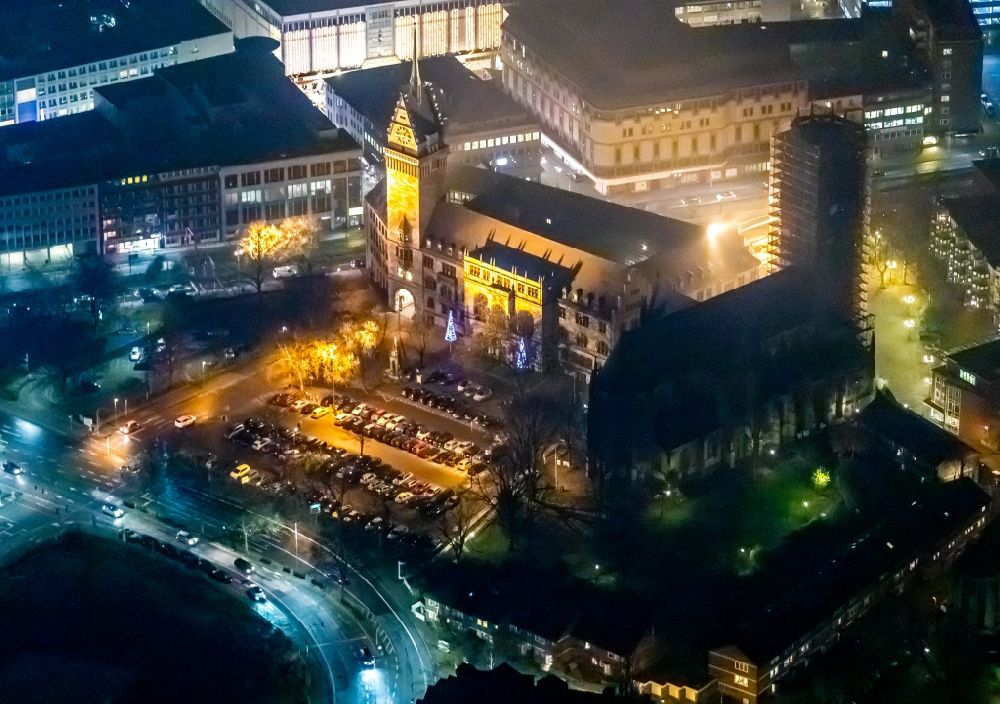Duisburg at night from the bird perspective: Night lighting town Salvator church and Hall building of the city administration in Duisburg in the state North Rhine-Westphalia, Germany