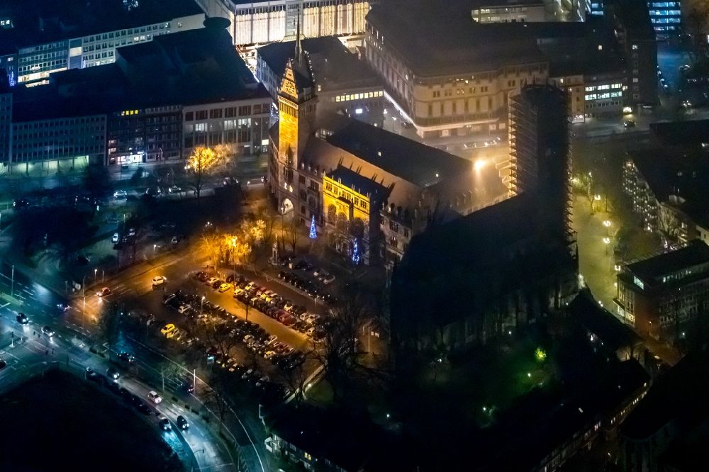 Aerial photograph at night Duisburg - Night lighting town Salvator church and Hall building of the city administration in Duisburg in the state North Rhine-Westphalia, Germany