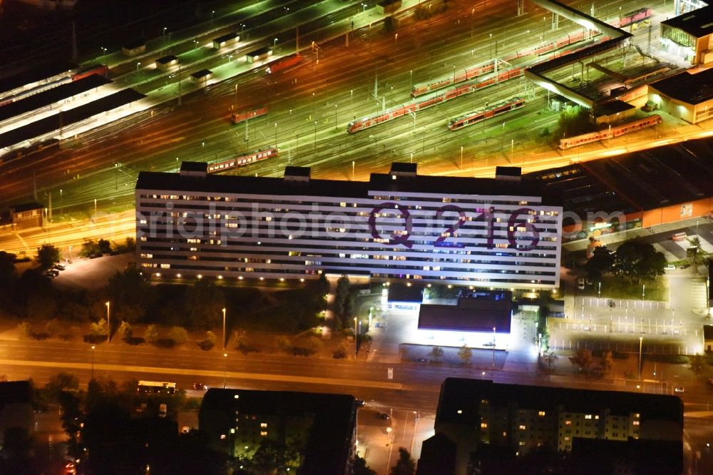 Berlin at night from above - Night view reorganized and modernized DDR block as students and single-residence Q 216 at Lichtenberg station in Berlin