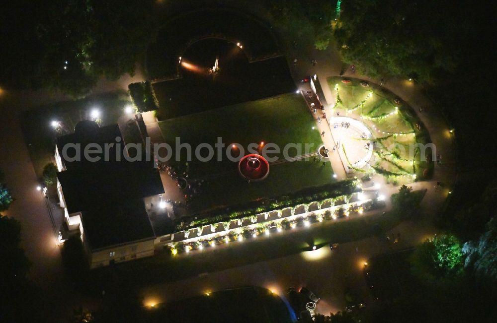 Potsdam at night from the bird perspective: Night lighting on castle show to Schloss Charlottenhof on Geschwister-Scholl-Strasse in Potsdam in the state Brandenburg