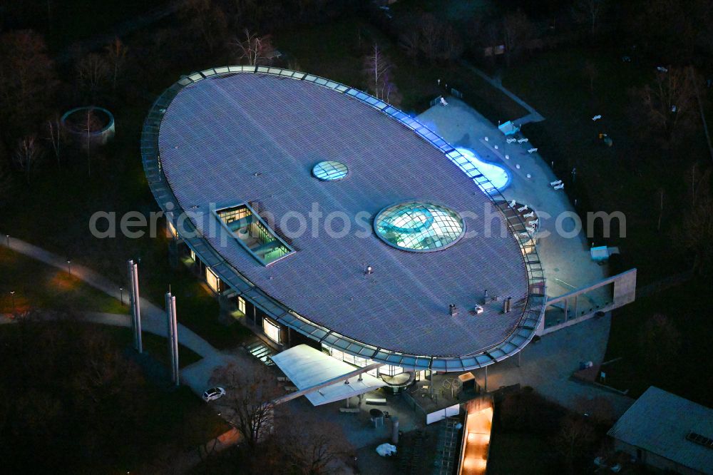 München at night from the bird perspective: Night lighting swimming pool of the Westbad on er Weinbergerstrasse in Munich in the state Bavaria, Germany