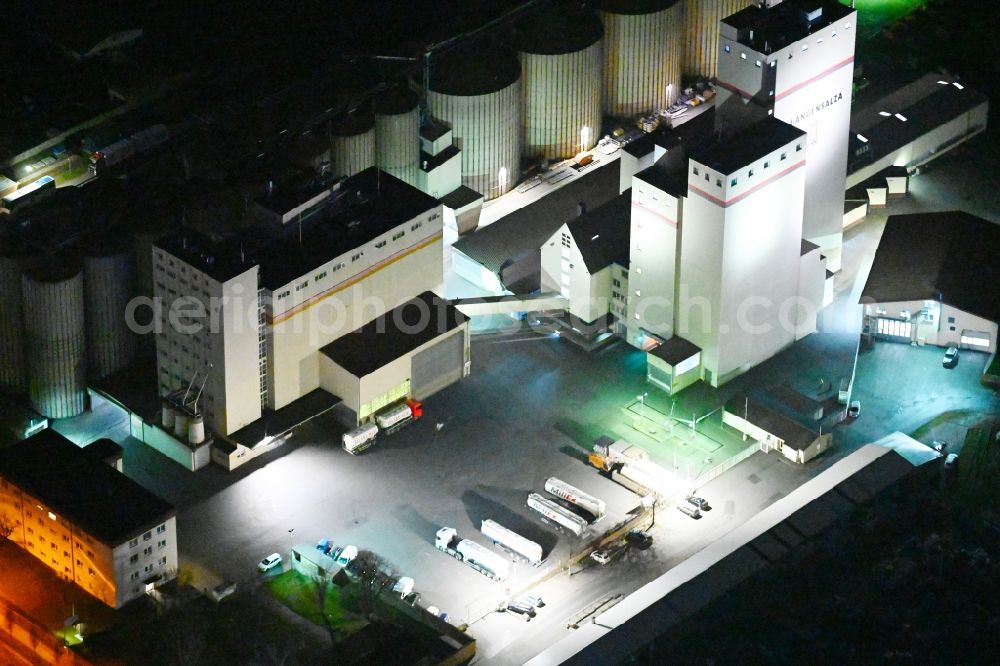 Bad Langensalza at night from above - Night lighting high silo and grain storage with adjacent storage of Roland Mills Ost GmbH & Co KG in Bad Langensalza in the state Thuringia, Germany