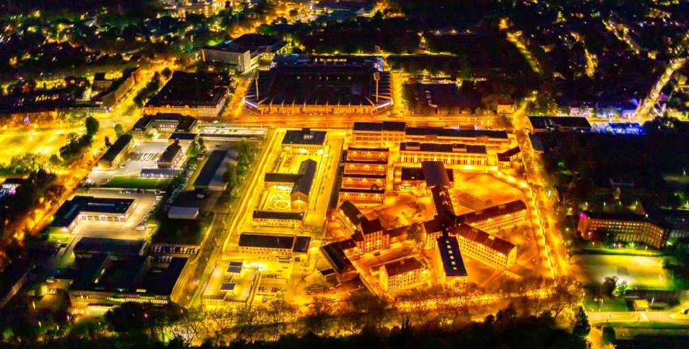 Aerial image at night Bochum - Night lighting social Therapeutic Institute on the site of prison premises and security fencing of the prison on Kruemmede in Bochum at Ruhrgebiet in the state North Rhine-Westphalia, Germany