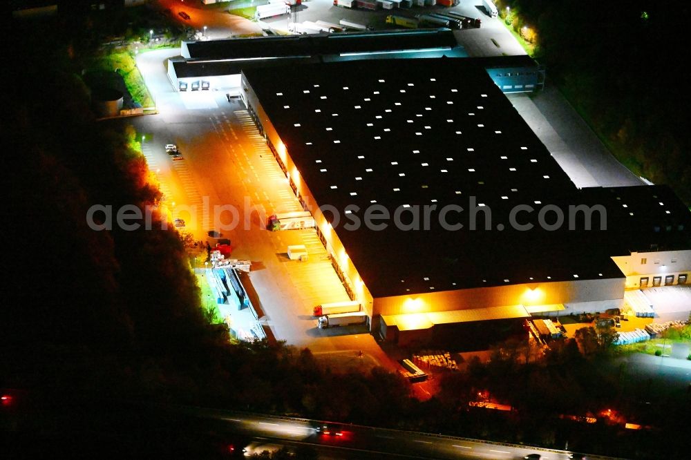 Friedrichsthal at night from above - Night lighting warehouses and forwarding building of Lidl Vertriebs GmbH & Co. KG (Zentrallager) Am Grubenbahnhof in Friedrichsthal in the state Saarland, Germany