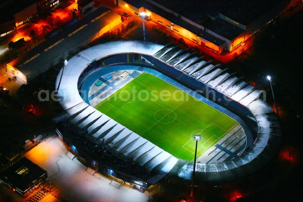 Braunschweig at night from the bird perspective: Night lighting Sports facility grounds of the Arena stadium in Braunschweig in the state Lower Saxony