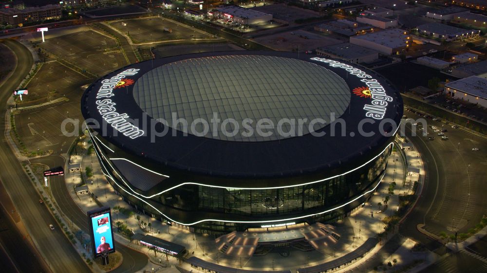 Las Vegas at night from the bird perspective: Night lighting sports facility grounds of the Arena stadium Allegiant Stadium on street Al Davis Way in Las Vegas in Nevada, United States of America