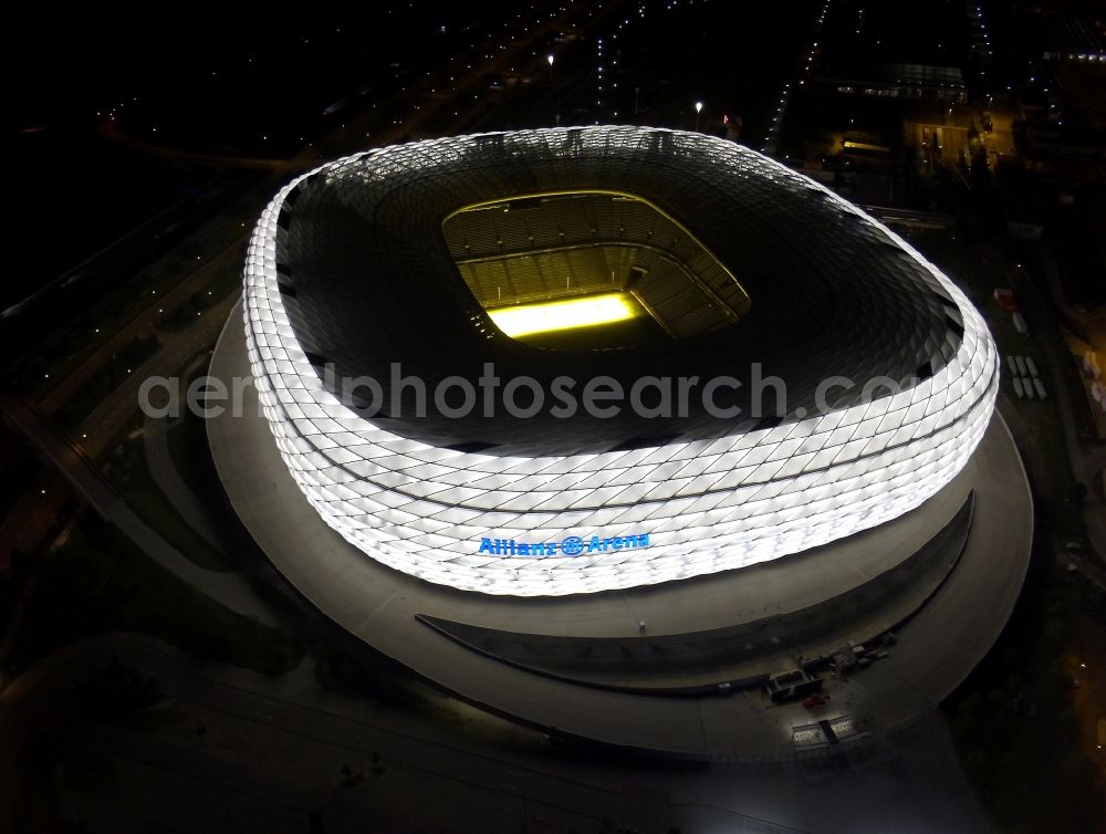 München at night from above - Night lighting sports facility grounds of the Arena stadium Allianz Arena on Werner-Heisenberg-Allee in Munich in the state Bavaria, Germany