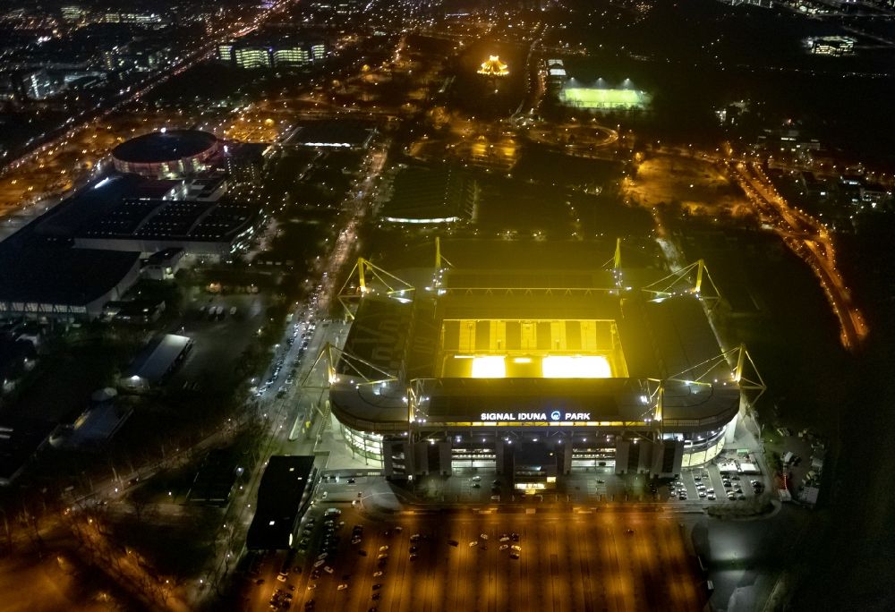 Dortmund at night from the bird perspective: Night lighting sports facility grounds of the Arena stadium in Dortmund in the state North Rhine-Westphalia