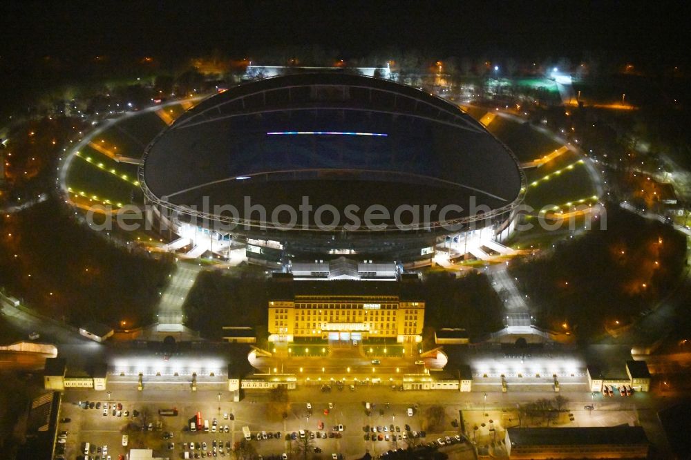 Leipzig at night from the bird perspective: Night lighting Sports facility grounds of the Arena stadium Red Bull Arena Am Sportforum in Leipzig in the state Saxony