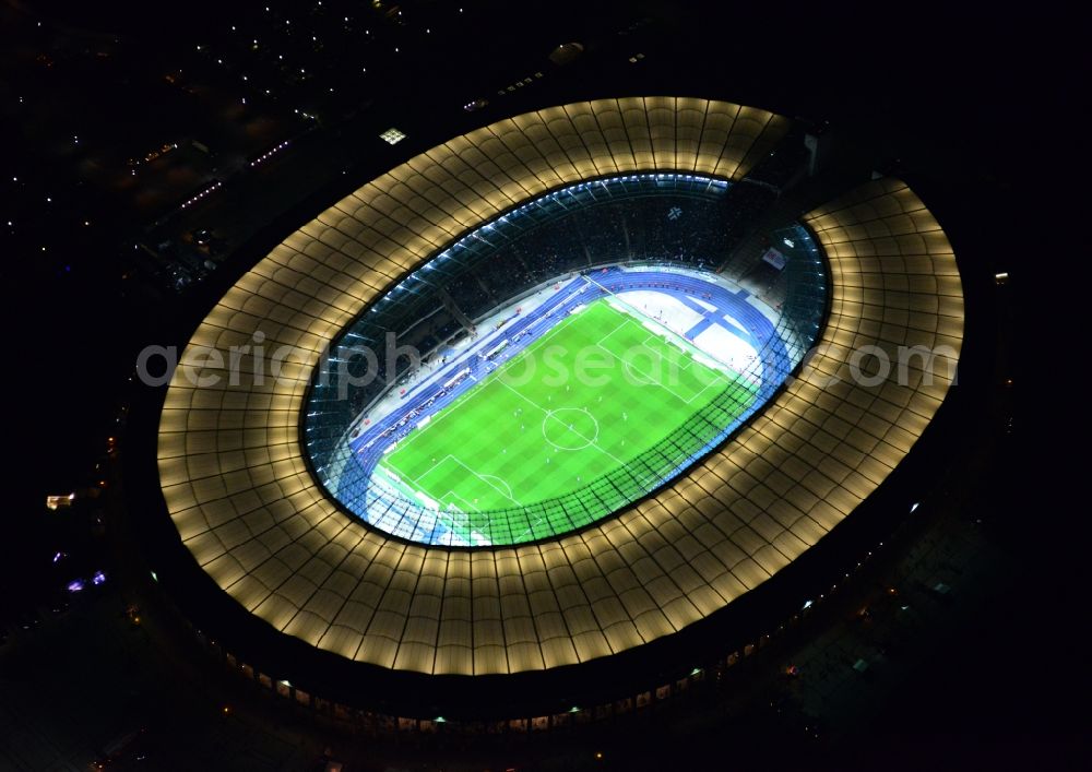 Aerial photograph at night Berlin - Night lighting Sports facility grounds of the Arena stadium Olympiastadion of Hertha BSC in Berlin in Germany