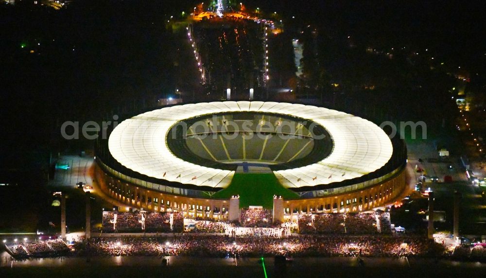 Berlin at night from above - Night lighting sports facility grounds of the Arena stadium Olympiastadion of Hertha BSC in Berlin in Germany