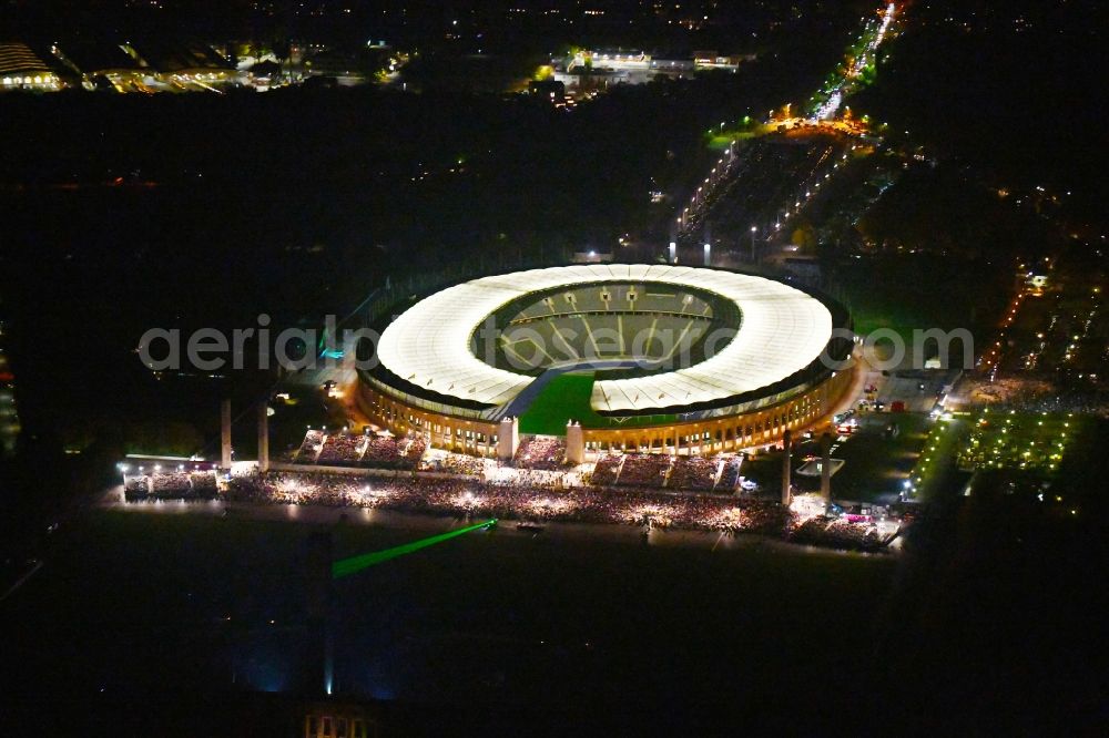 Aerial photograph at night Berlin - Night lighting sports facility grounds of the Arena stadium Olympiastadion of Hertha BSC in Berlin in Germany