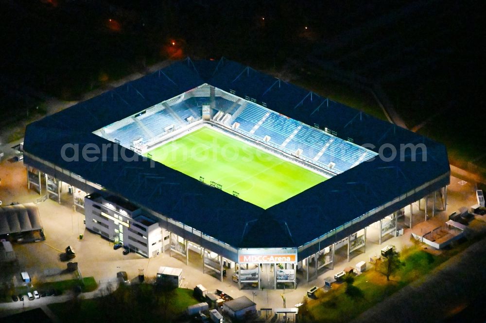 Aerial image at night Magdeburg - Night lighting sports facility grounds of the MDCC Arena stadium in Magdeburg in the state Saxony-Anhalt