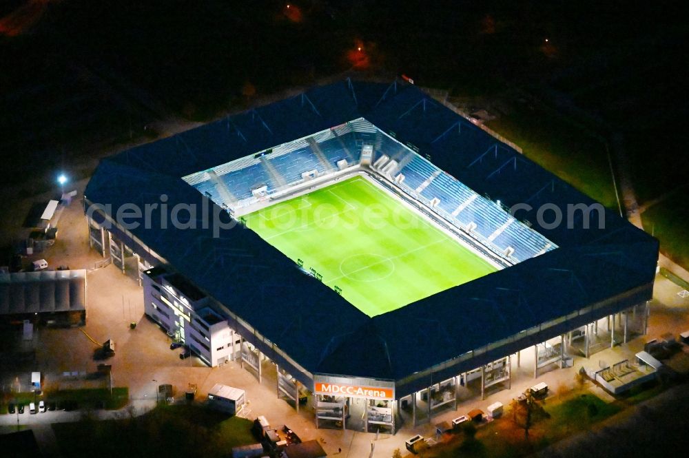 Magdeburg at night from above - Night lighting sports facility grounds of the MDCC Arena stadium in Magdeburg in the state Saxony-Anhalt