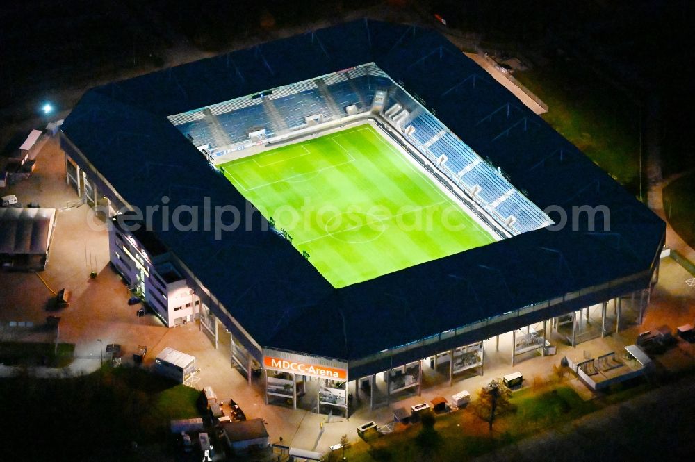 Magdeburg at night from the bird perspective: Night lighting sports facility grounds of the MDCC Arena stadium in Magdeburg in the state Saxony-Anhalt