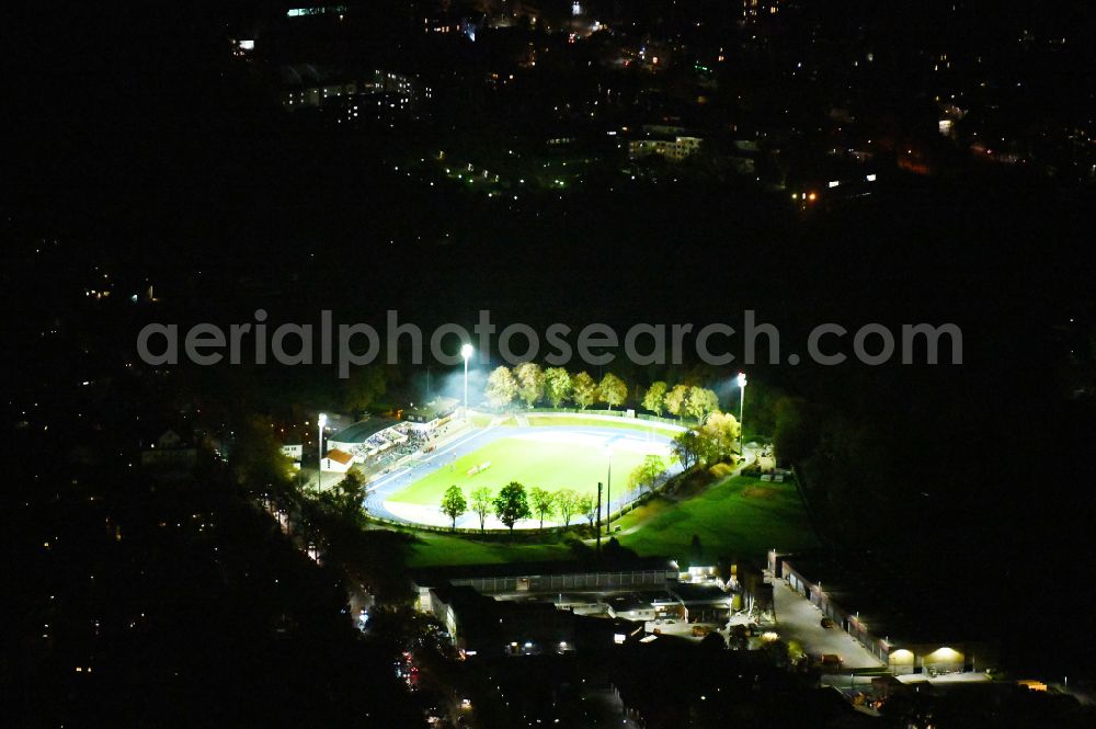 Berlin at night from above - Night lighting sports facility grounds of stadium Lichterfelde in Berlin, Germany