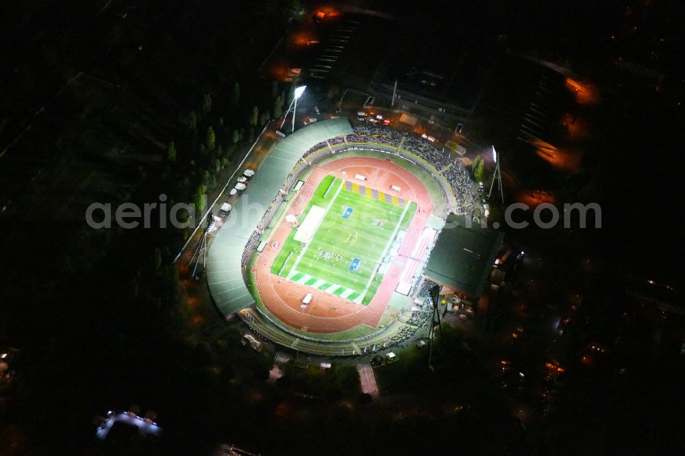 Aerial photograph at night Berlin - Night lighting Stadium at the Friedrich-Ludwig-Jahn-Sportpark in Berlin Prenzlauer Berg