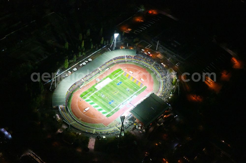 Aerial image at night Berlin - Night lighting Stadium at the Friedrich-Ludwig-Jahn-Sportpark in Berlin Prenzlauer Berg