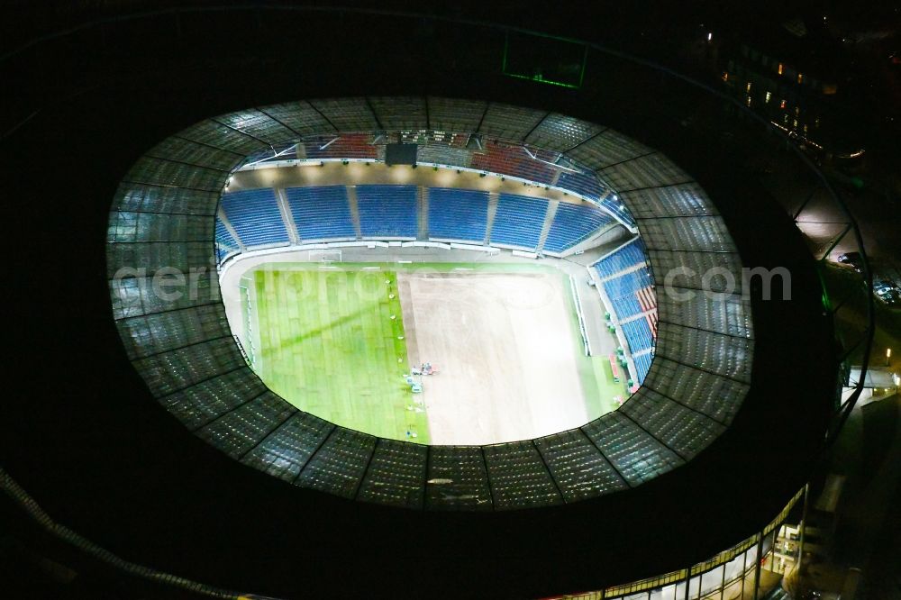 Aerial photograph at night Hannover - Night lighting HDI Arena stadium in Calenberger Neustadt district of Hanover, in Lower Saxony