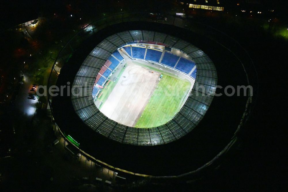 Hannover at night from the bird perspective: Night lighting HDI Arena stadium in Calenberger Neustadt district of Hanover, in Lower Saxony