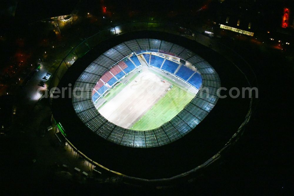 Aerial photograph at night Hannover - Night lighting HDI Arena stadium in Calenberger Neustadt district of Hanover, in Lower Saxony