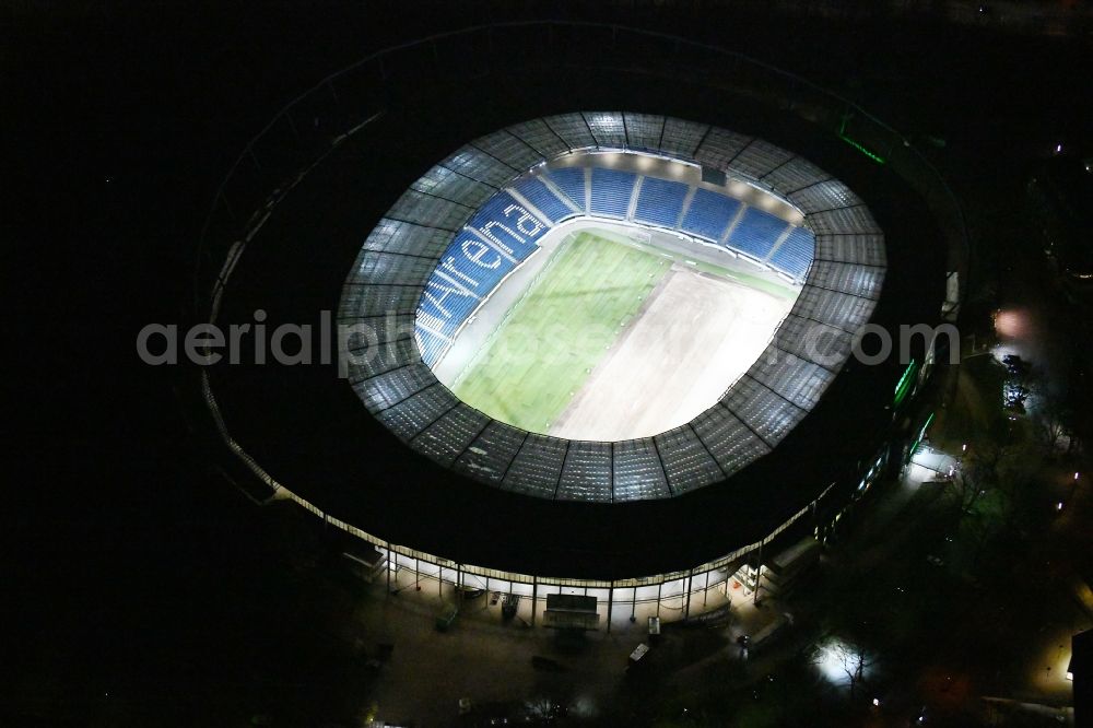 Hannover at night from the bird perspective: Night lighting HDI Arena stadium in Calenberger Neustadt district of Hanover, in Lower Saxony
