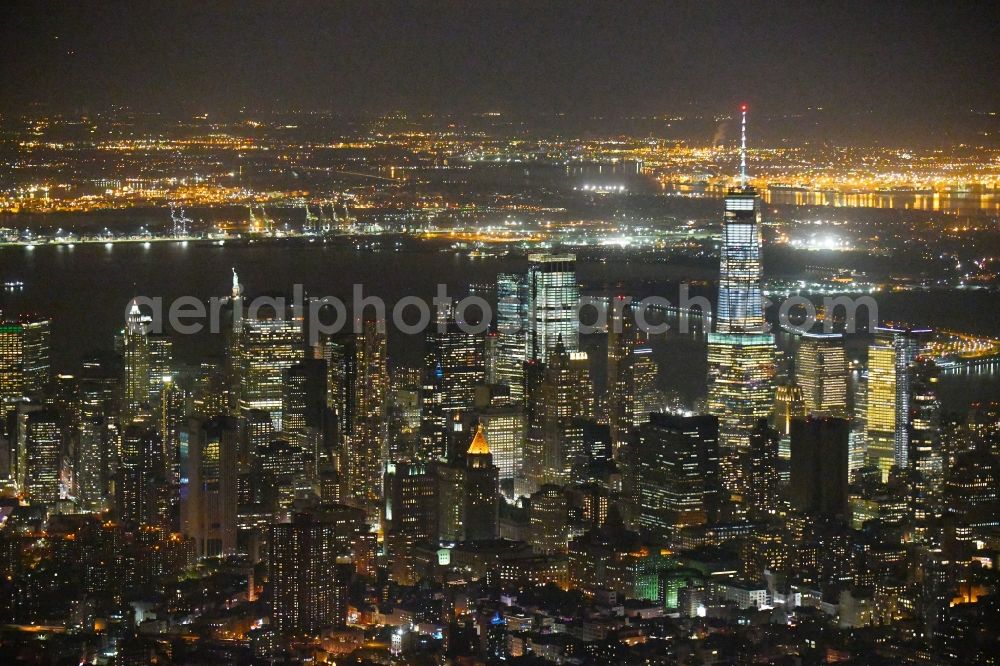 Aerial photograph at night New York - Night lighting City view of the city area of in the district Manhattan in New York in United States of America
