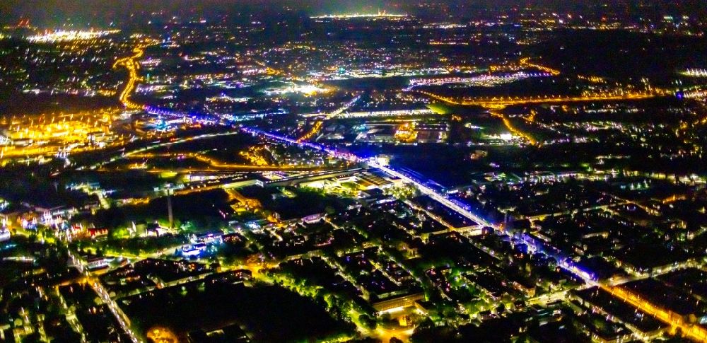 Aerial photograph at night Gelsenkirchen - Night lighting city view of downtown area with Fernbus Haltestelle Gelsenkirchen - Postbus on Husemannstrasse in Gelsenkirchen at Ruhrgebiet in the state North Rhine-Westphalia, Germany