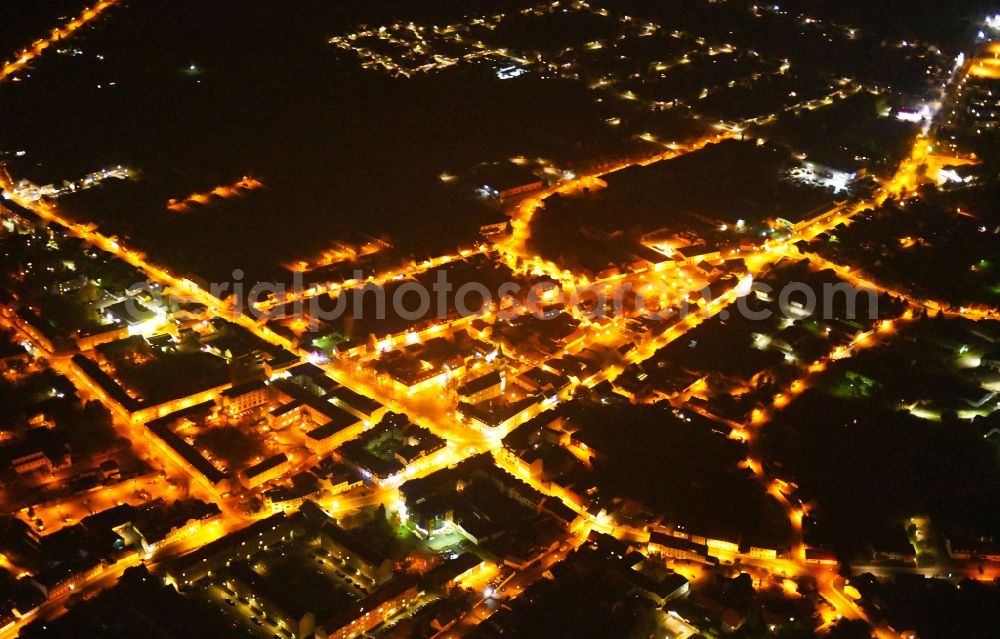 Seelow at night from the bird perspective: Night lighting City view of downtown area in Seelow in the state Brandenburg, Germany