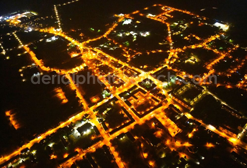 Aerial image at night Seelow - Night lighting City view of downtown area in Seelow in the state Brandenburg, Germany
