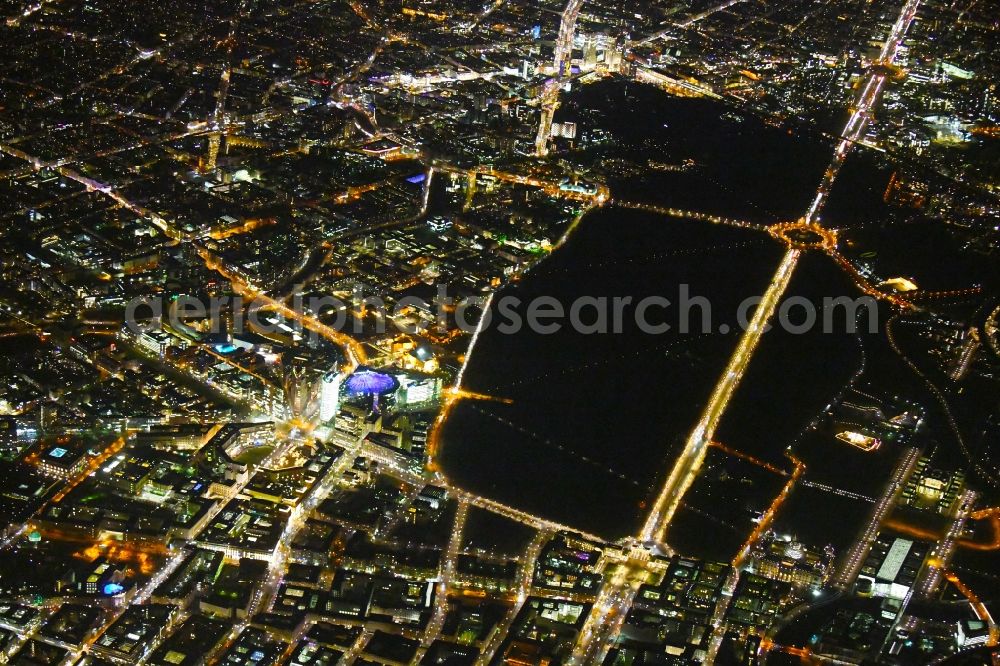 Aerial photograph at night Berlin - Night lighting The city center in the downtown area with Leipziger and Potsdamer Platz, parc garden Tiergarten, Strasse of 17.Juni, Gate Brandenburger Tor and place Pariser Platz in the district Mitte in Berlin, Germany