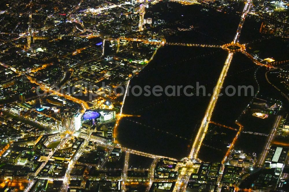 Aerial image at night Berlin - Night lighting The city center in the downtown area with Leipziger and Potsdamer Platz, parc garden Tiergarten, Strasse of 17.Juni, Gate Brandenburger Tor and place Pariser Platz in the district Mitte in Berlin, Germany