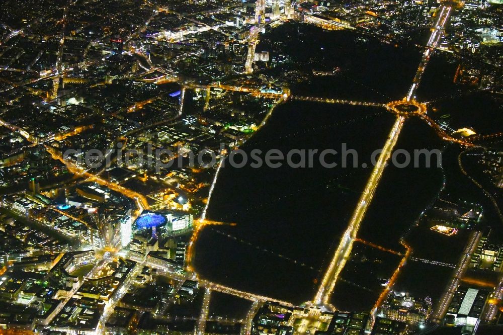 Berlin at night from above - Night lighting The city center in the downtown area with Leipziger and Potsdamer Platz, parc garden Tiergarten, Strasse of 17.Juni, Gate Brandenburger Tor and place Pariser Platz in the district Mitte in Berlin, Germany