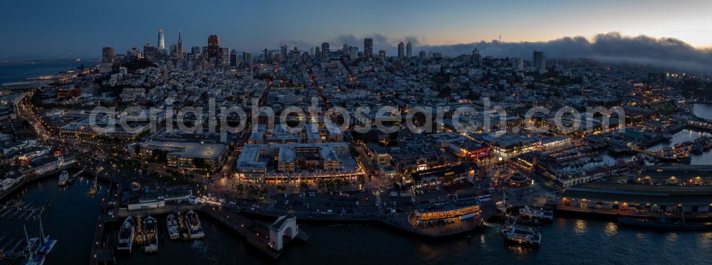 Aerial photograph at night San Francisco - Night lighting the city center in the downtown area San Francisco on street U.S. 101 in San Francisco in California, United States of America
