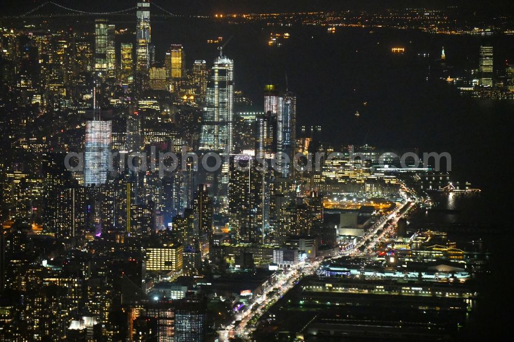 Aerial image at night New York - Night lighting City center with the skyline in the downtown area on 12th Ave in the district Manhattan in New York in United States of America