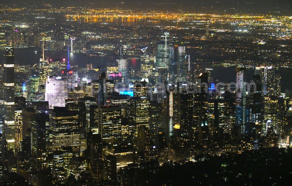 New York at night from above - Night lighting City center with the skyline in the downtown area in the district Manhattan in New York in United States of America