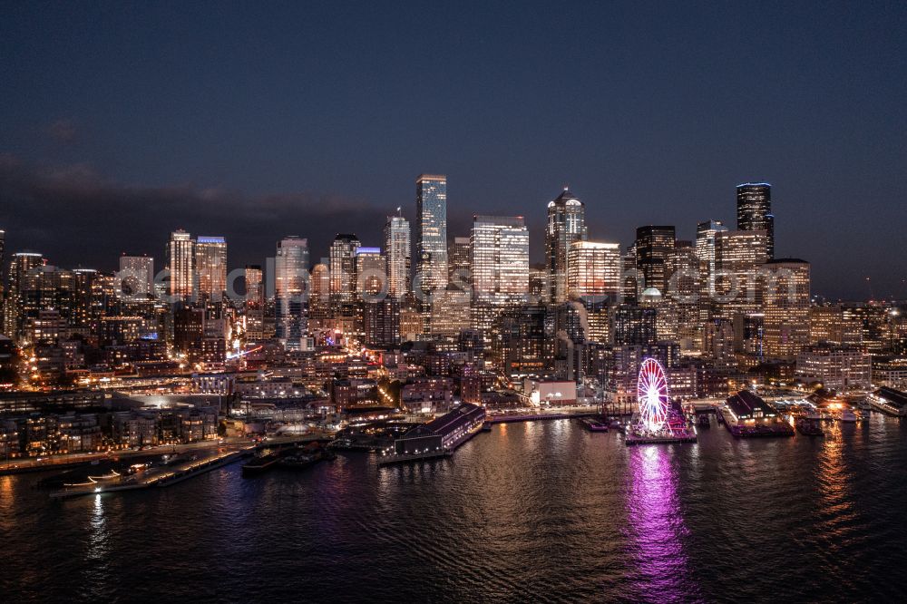 Seattle at night from the bird perspective: Night lighting city center with the skyline in the downtown area in Seattle in Washington, United States of America