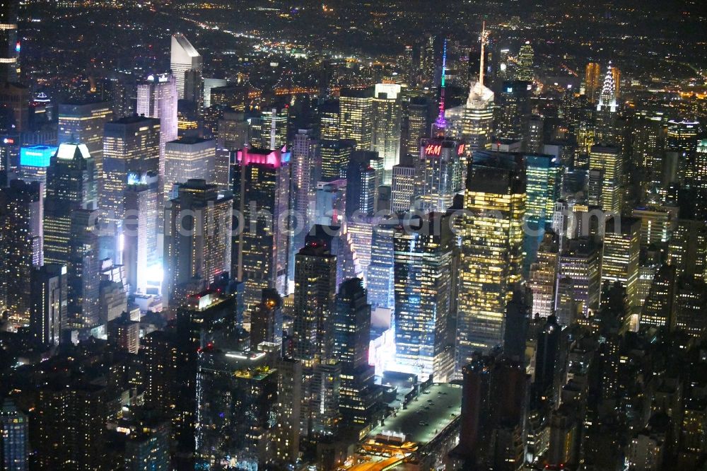 New York at night from above - Night lighting City center with the skyline in the downtown area Broadway - Times Square - Seventh Avenue in the district Manhattan in New York in United States of America