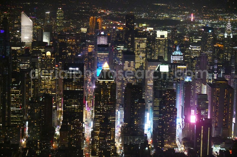 Aerial image at night New York - Night lighting City center with the skyline between Times Squar - Broadway in the downtown area in the district Manhattan in New York in United States of America