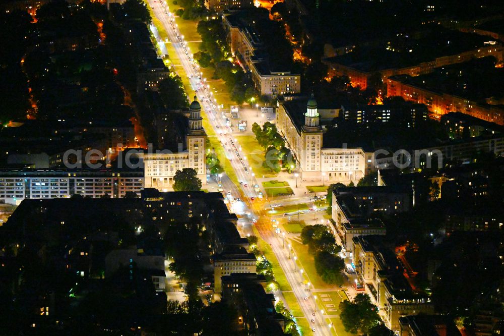 Berlin at night from above - Night view of street guide of famous promenade and shopping street Frankfurter Allee - place Frankfurter Tor and formerly cinema building KOSMOS destrict Friedrichshain in Berlin
