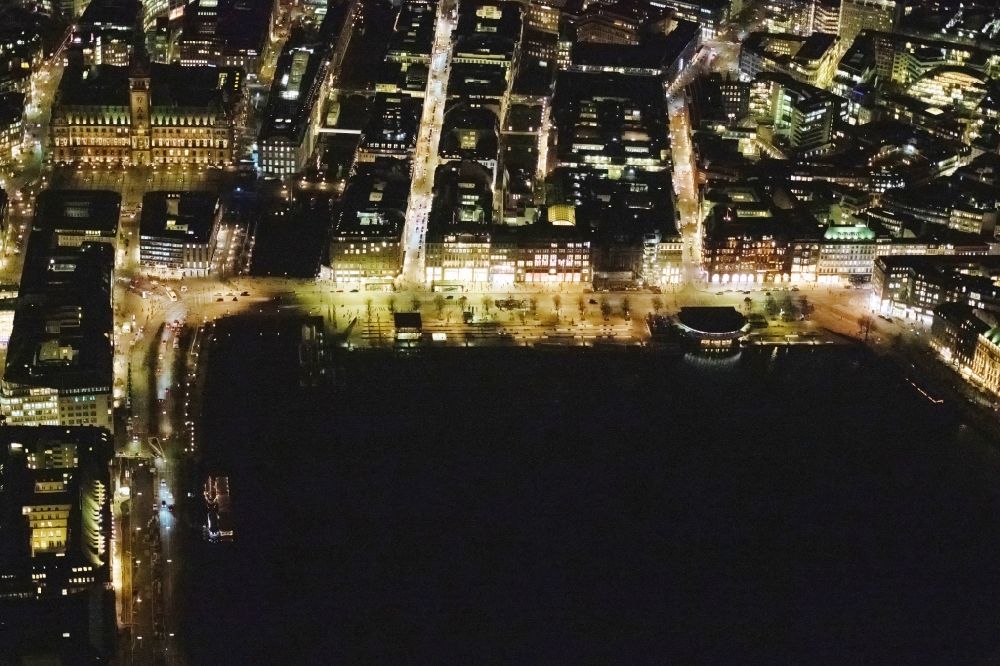 Aerial image at night Hamburg - Night lighting street guide of famous promenade and shopping street Jungfernstieg on Ufer of Binnenalster in the district Neustadt in Hamburg, Germany